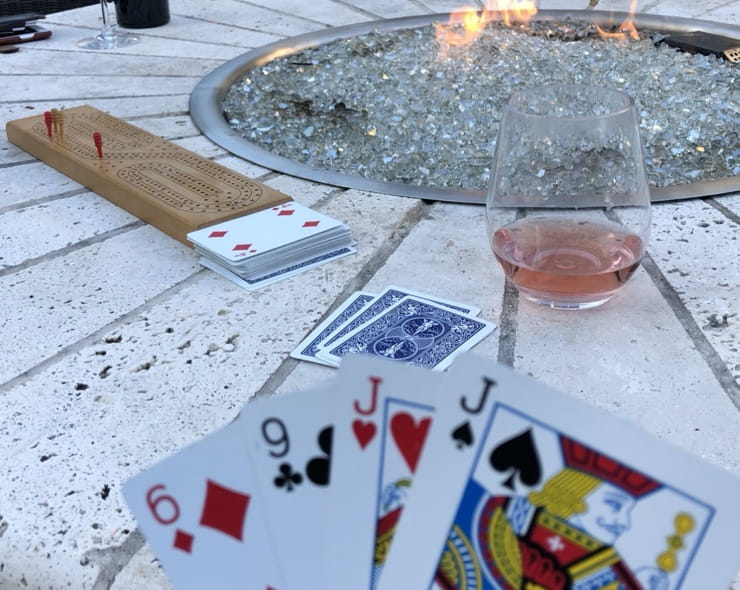 Katy playing cribbage by the fire