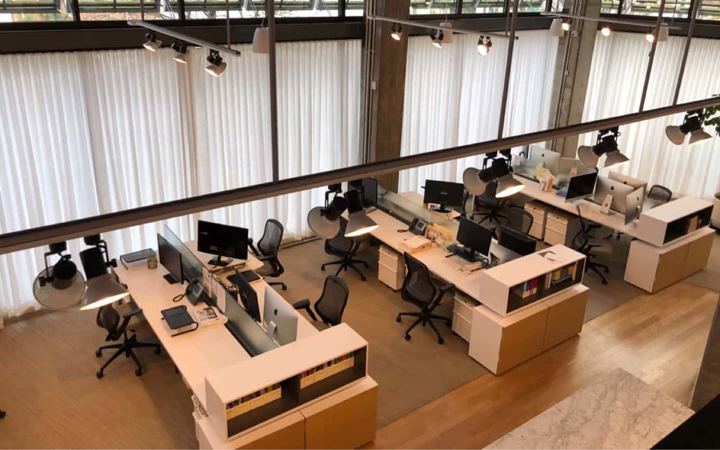 A view of the Rivers office with computers and empty desks